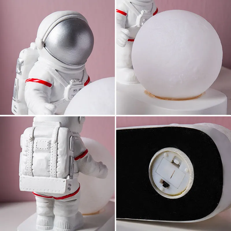 Gold resin astronaut night light on shelf, 14.5cm tall figurine with soft glow