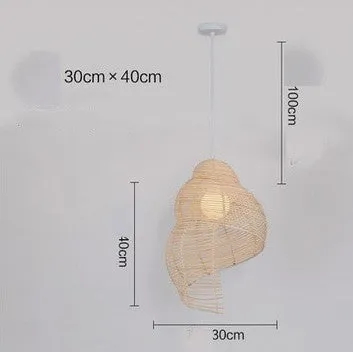 Snail-shaped rattan pendant light with woven grass and rattan shade, 350mm diameter, LED source, adjustable height, on a dark background