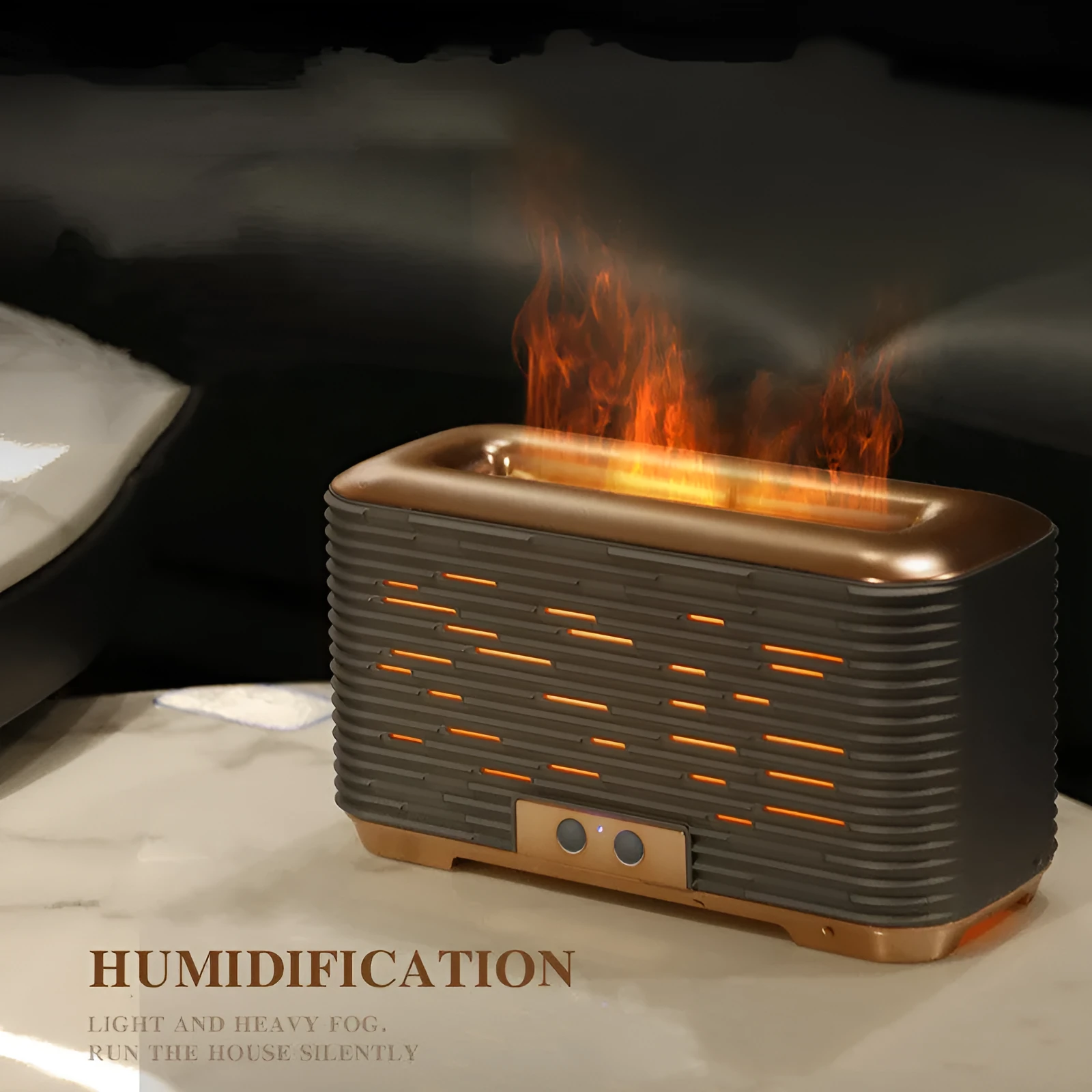 Flame aroma diffuser humidifier in gold with double-colour atmosphere light on a desktop