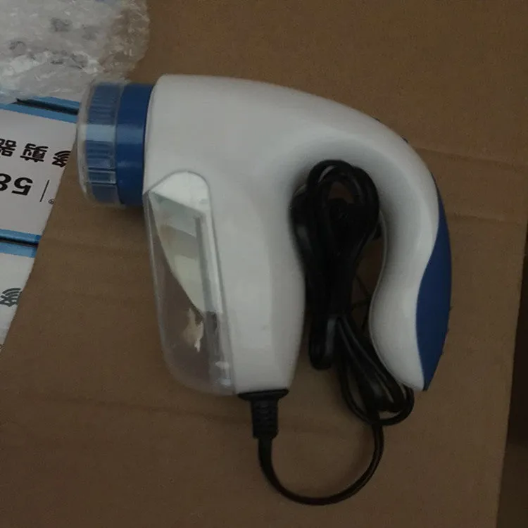 Blue electric fabric hair ball trimmer with straight-in clothes design for fleece and wool, compact size 100x70x70mm, Europe plug