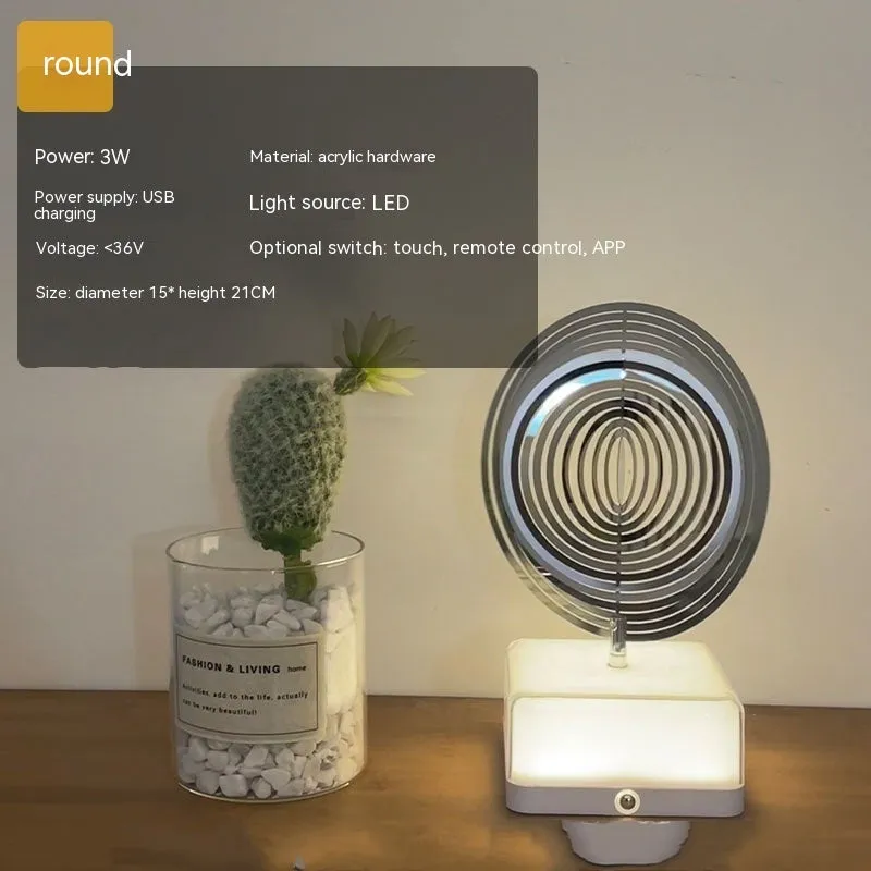 Creative rotating ambience LED night light with 16 colour remote control, acrylic and metal construction