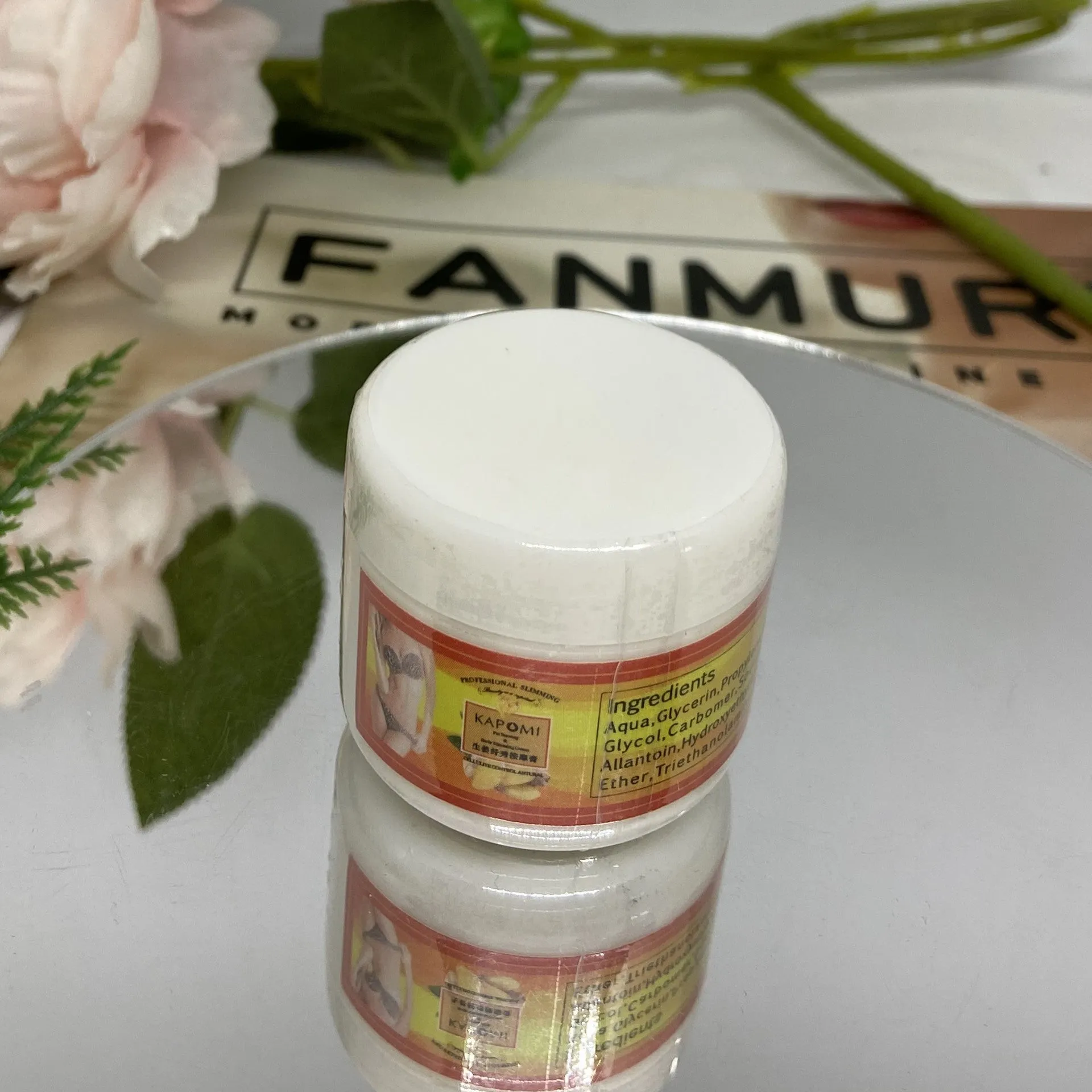 Ginger firming massage cream in a jar, 50g net content, photo colour