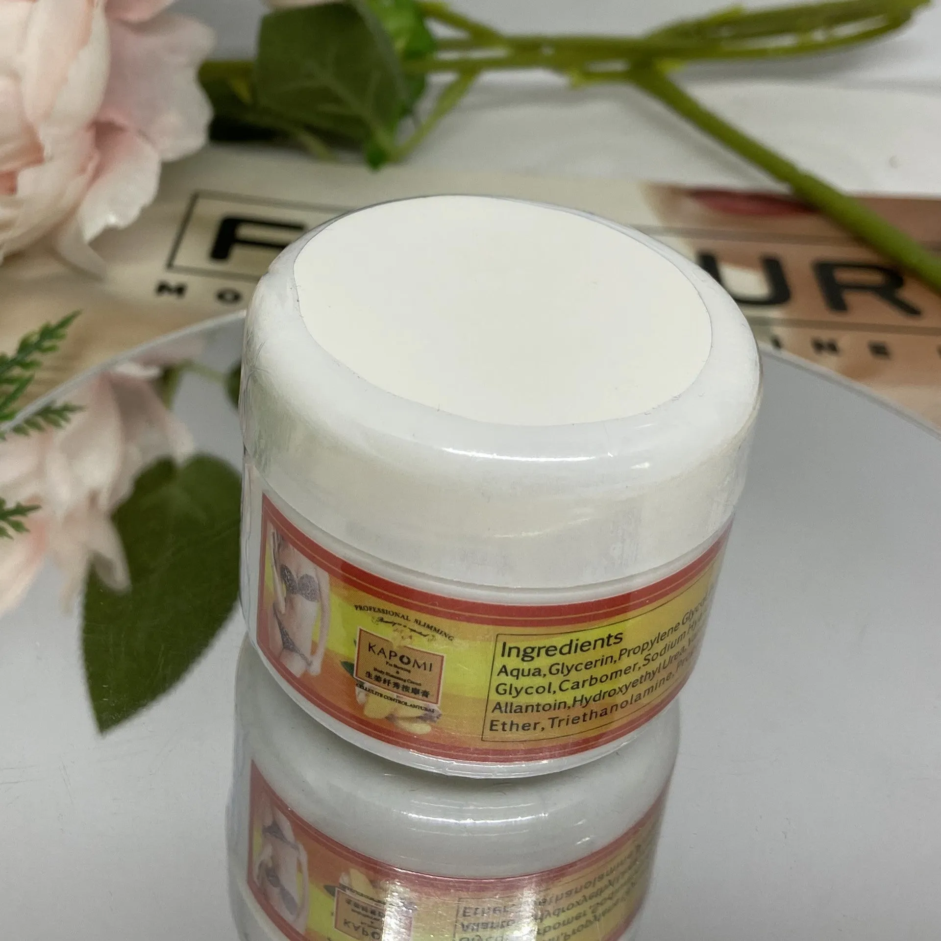 Ginger firming massage cream in a jar, 50g net content, photo colour