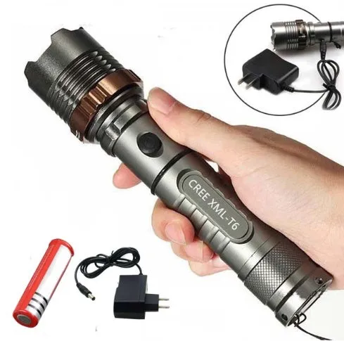 Grey CREE T6 LED flashlight with crenellated strike bezel and adjustable focus