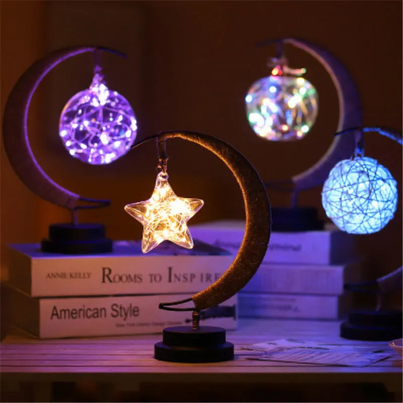 Warm white dimmable LED modelling light in apple shape with 10 beads on a wooden table
