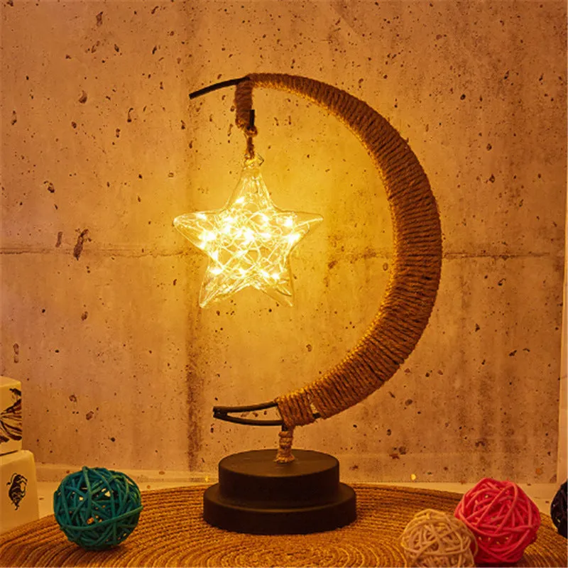 Warm white dimmable LED modelling light in apple shape with 10 beads on a wooden table