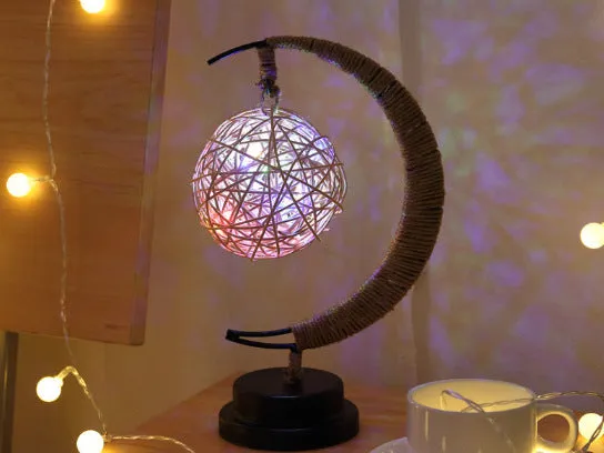 Warm white dimmable LED modelling light in apple shape with 10 beads on a wooden table