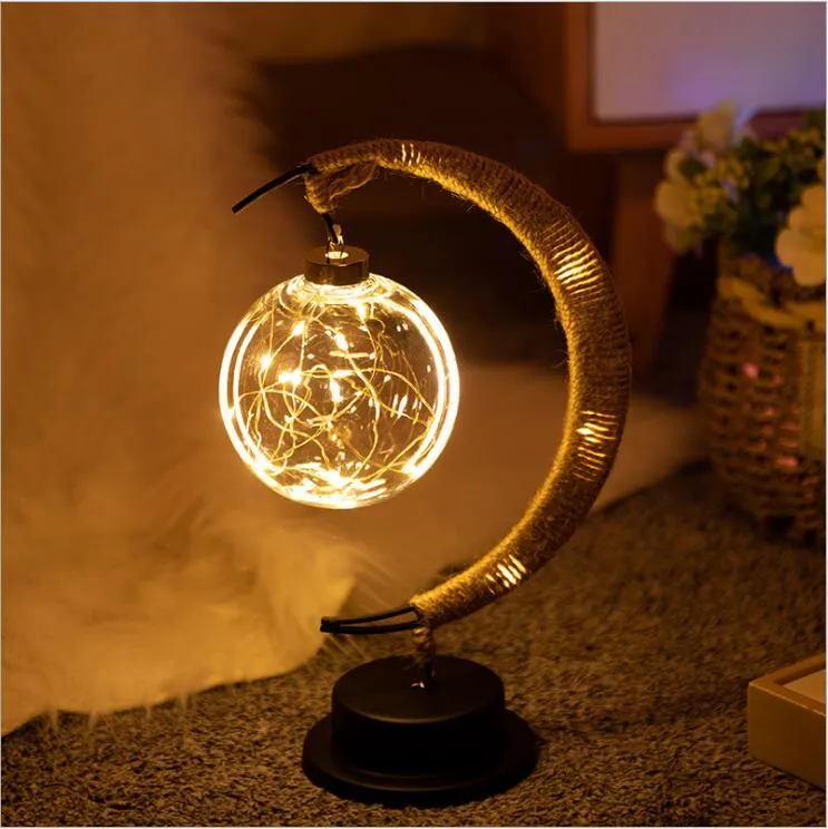 Warm white dimmable LED modelling light in apple shape with 10 beads on a wooden table