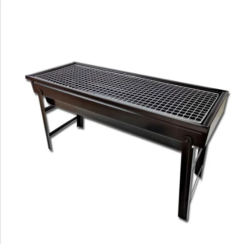 Folding portable charcoal barbecue grill on outdoor table showing 35x27x20cm cooking area