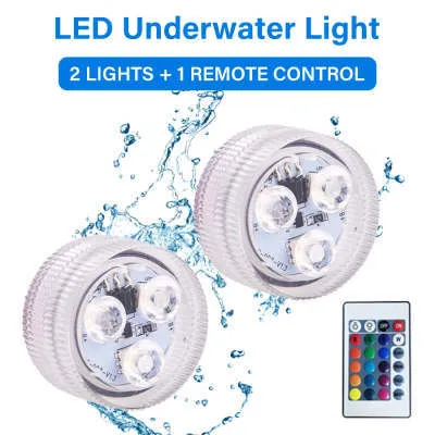 Compact white plastic remote control LED diving light for aquarium, shown with remote.