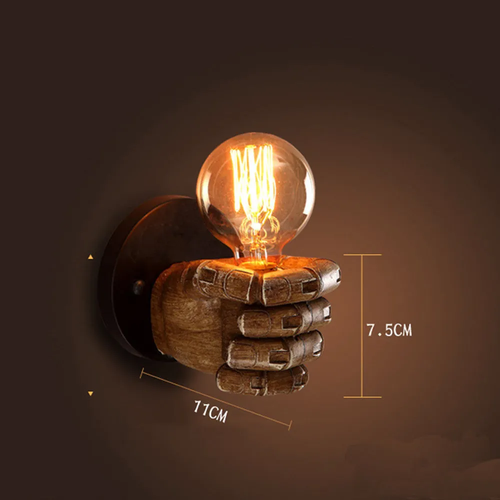 Brown resin fist-shaped decorative wall lamp with E27 bulb holder on a wall