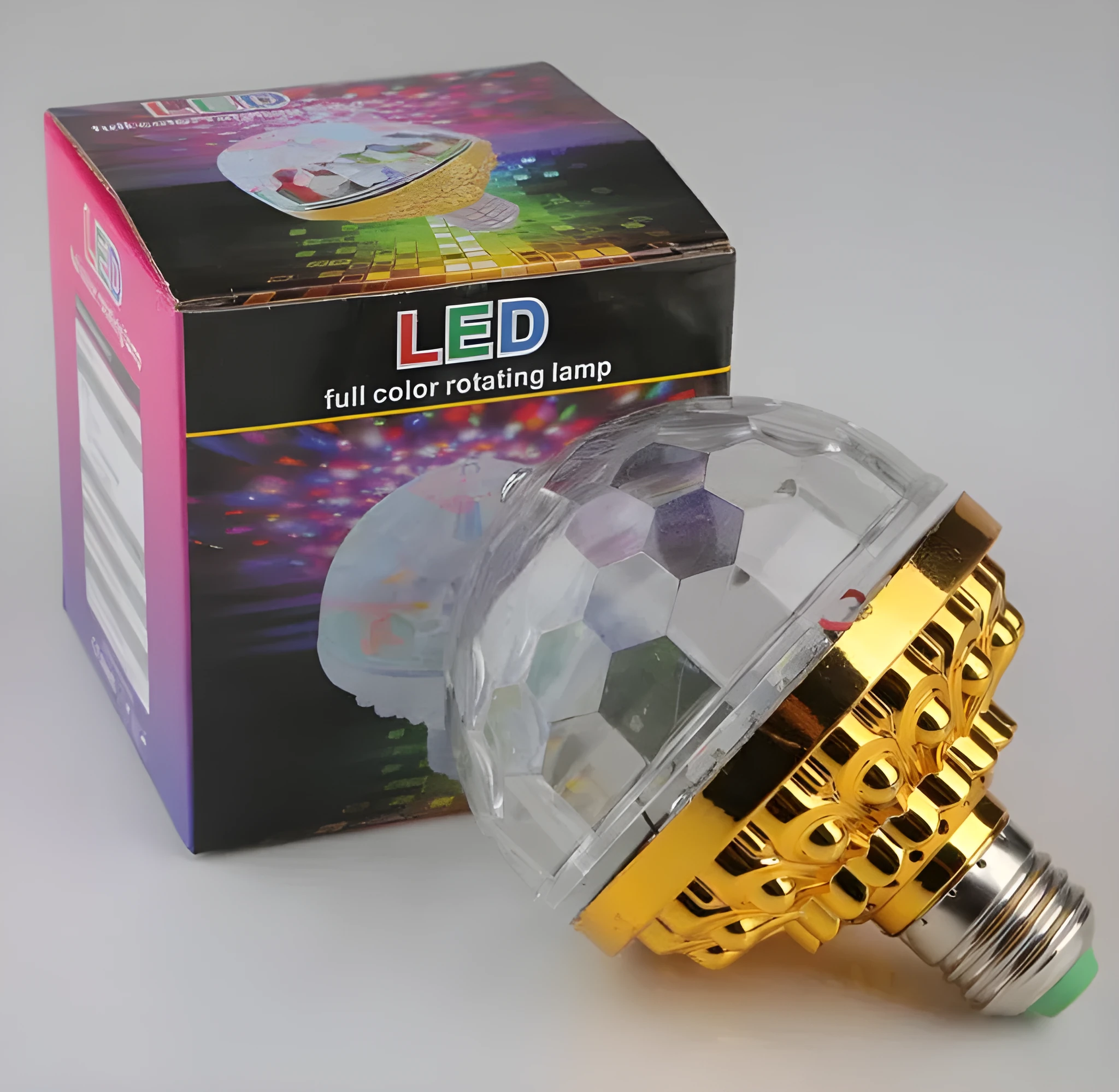 LED colourful rotating magic ball light with 6 RGB beads and lamp holder on a table
