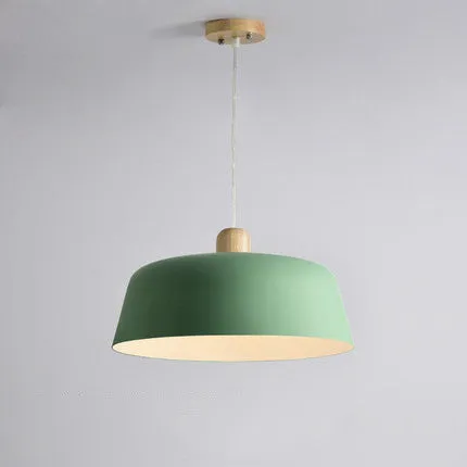 Round zinc alloy Nordic pendant hanging lamp in black finish with 38cm diameter over a dining table