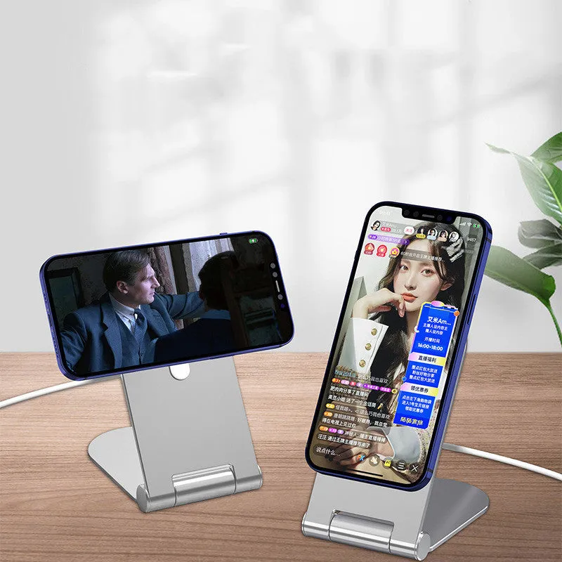 Silver vertical adjustable magnetic phone bracket for iPhone 12 on a car dashboard.