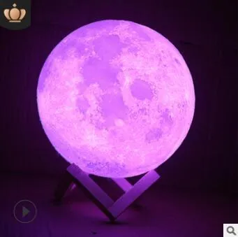 Luna Tranquil Moon Lamp with realistic moon texture and touch colour control on a bedside table