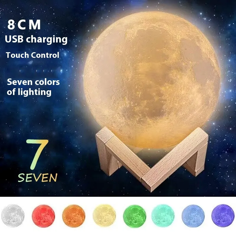 Luna Tranquil Moon Lamp with realistic moon texture and touch colour control on a bedside table