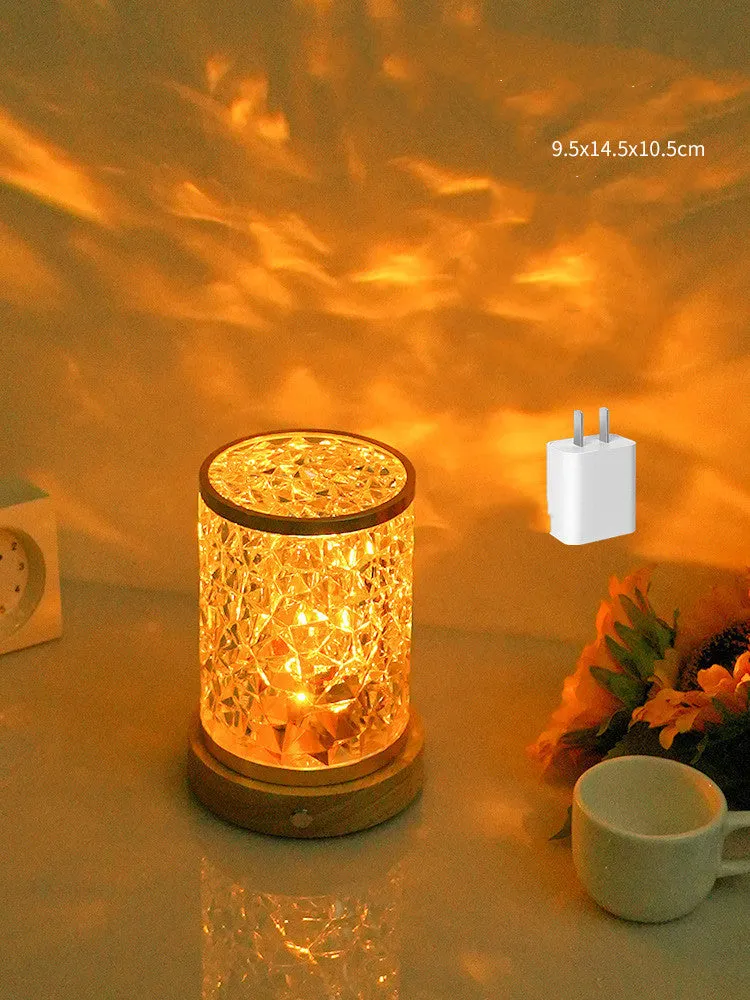Rotating water ripple effect small night light on a solid wood base with USB cable