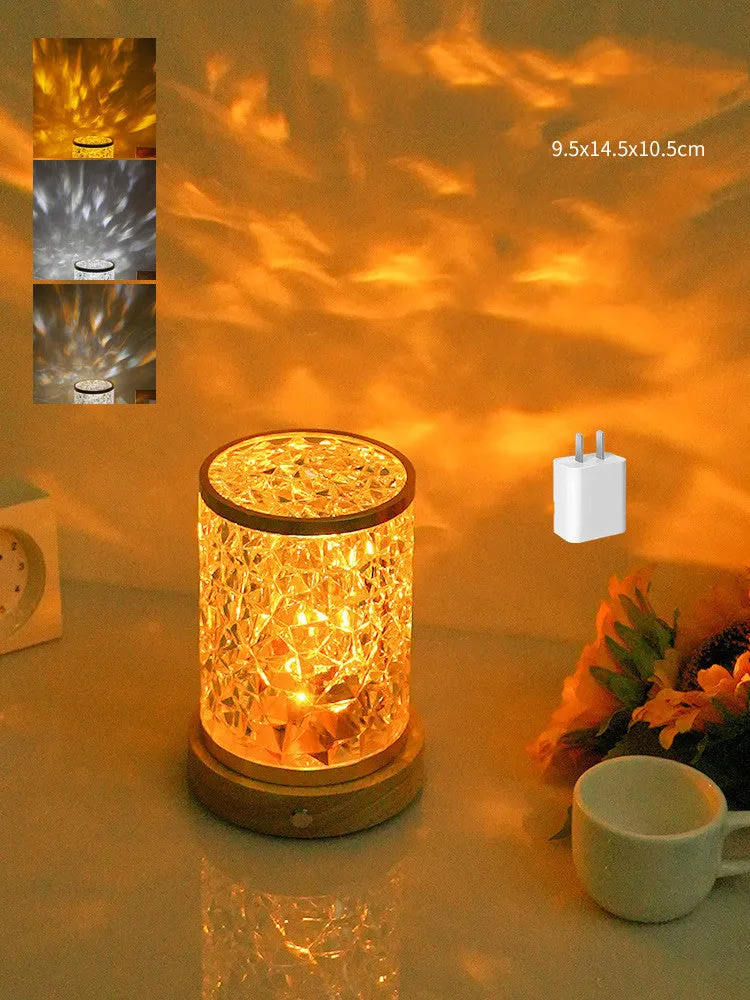 Rotating water ripple effect small night light on a solid wood base with USB cable