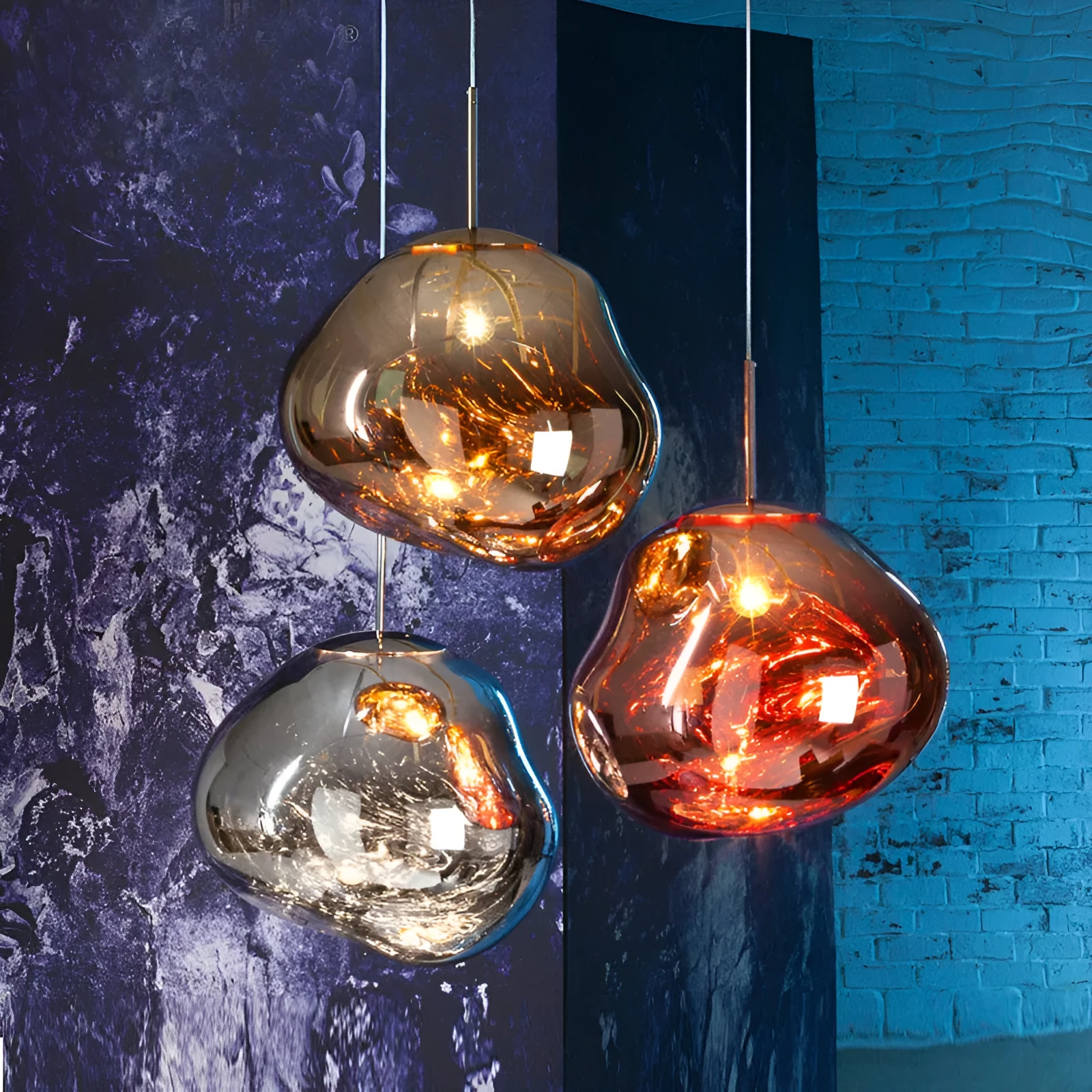 A modern irregular shaped glass chandelier with a Nordic design in a gold finish, hanging from a ceiling.