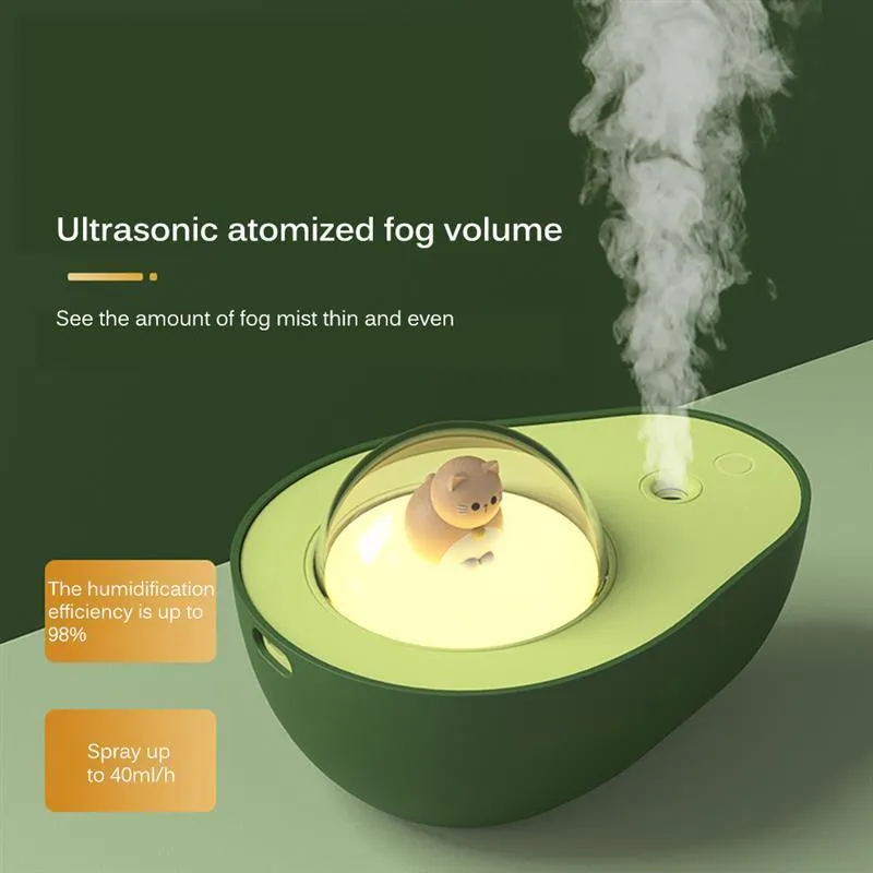 Green avocado-shaped mini humidifier with USB cable and night light on a desk