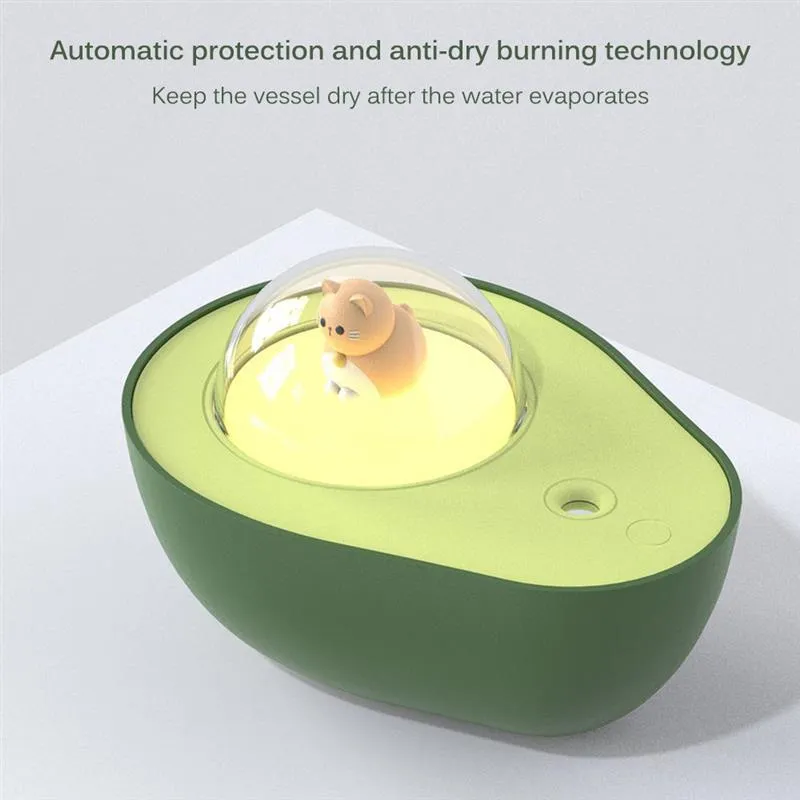 Green avocado-shaped mini humidifier with USB cable and night light on a desk