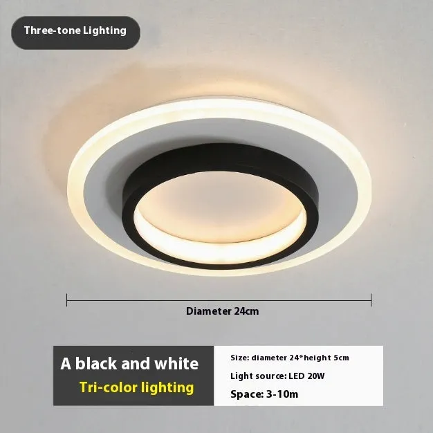 Black circular LED corridor light with aluminium and acrylic construction, 21cm diameter, for balcony or porch use