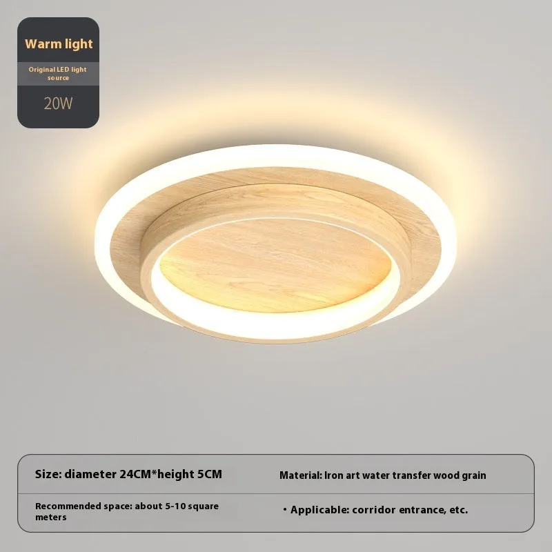 Black circular LED corridor light with aluminium and acrylic construction, 21cm diameter, for balcony or porch use