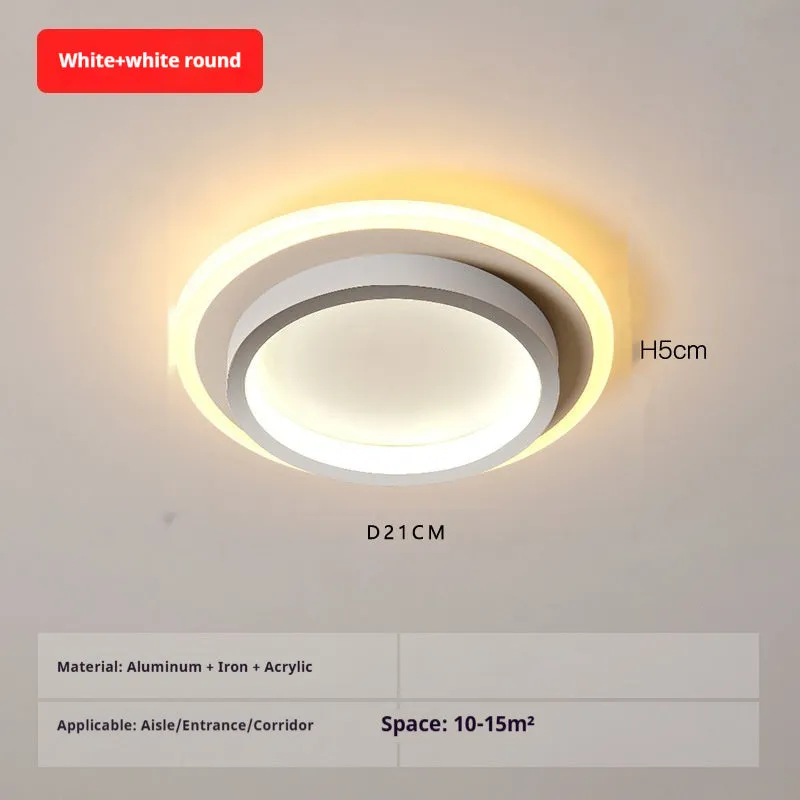 Black circular LED corridor light with aluminium and acrylic construction, 21cm diameter, for balcony or porch use