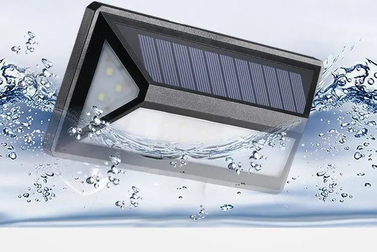 Black solar wall light with 33 LEDs, IP65 rated, measuring 166x75x30mm, mounted on an exterior wall