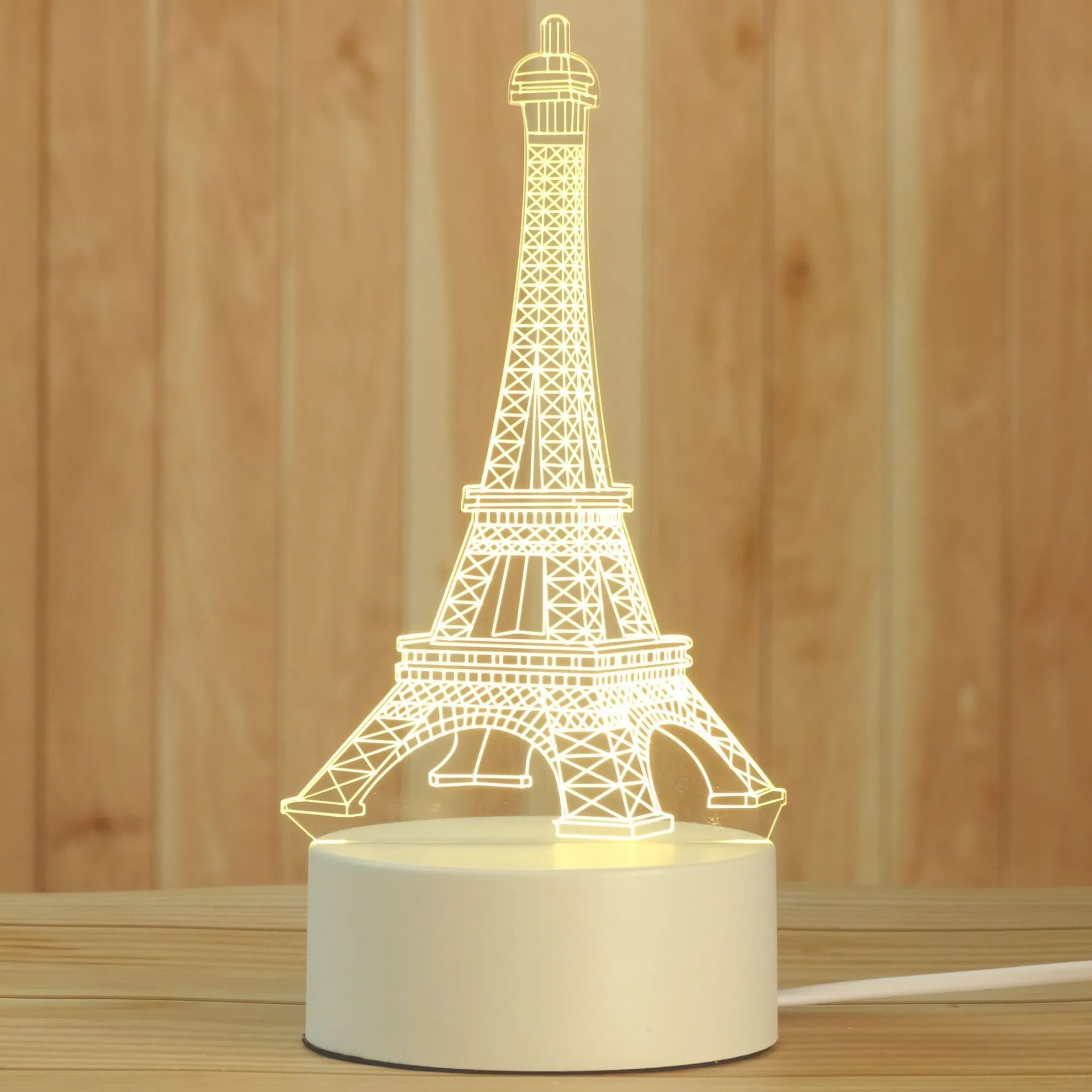 Creative electronic night light with acrylic light board showing USB cable, touch control, and three colour modes on a bedside table