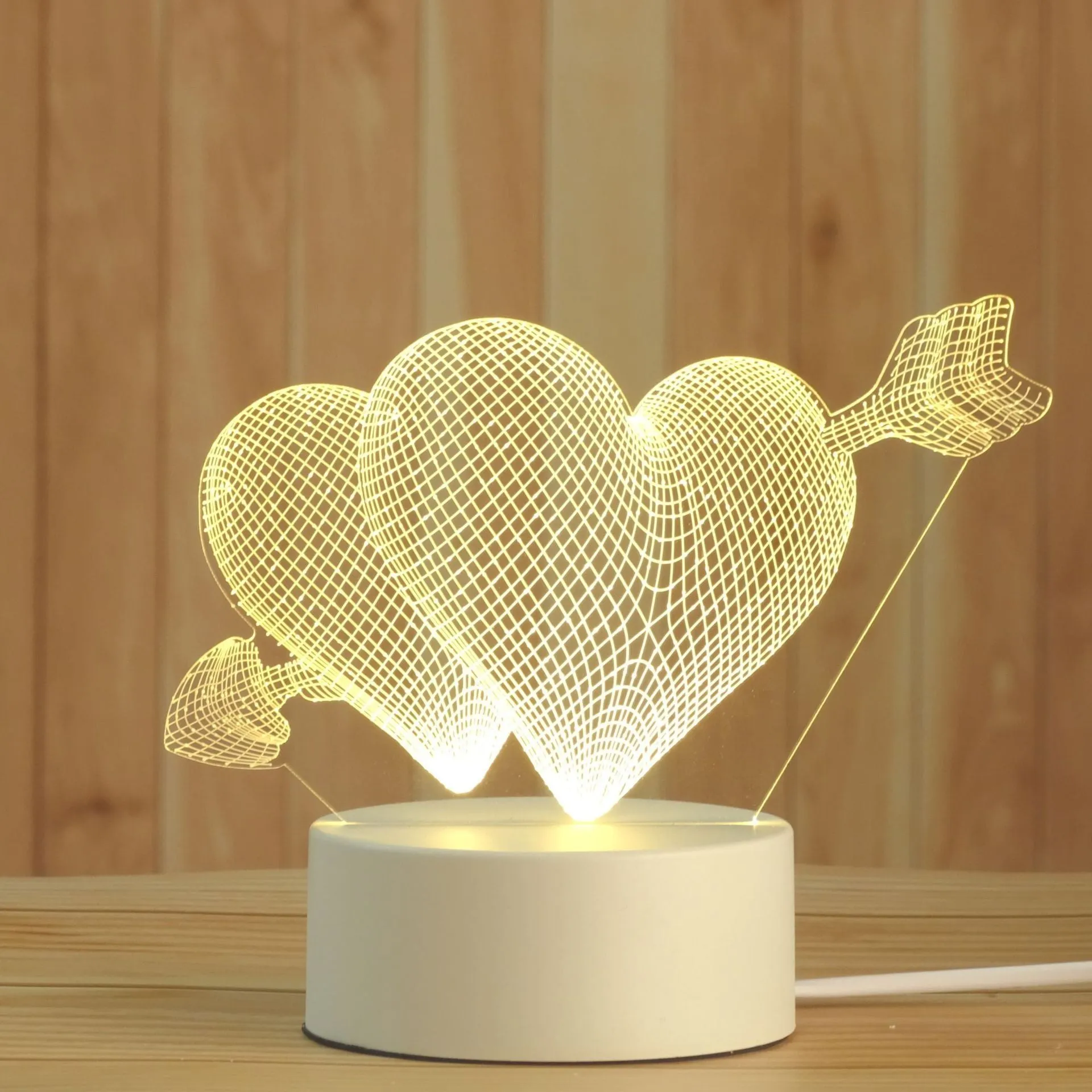 Creative electronic night light with acrylic light board showing USB cable, touch control, and three colour modes on a bedside table
