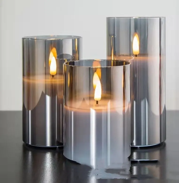 Set of three LED electronic candle lights in gold, gray, and white electroplated glass, sizes 7.5x10cm, 7.5x12.5cm, 7.5x15cm, with a remote control and USB cable.