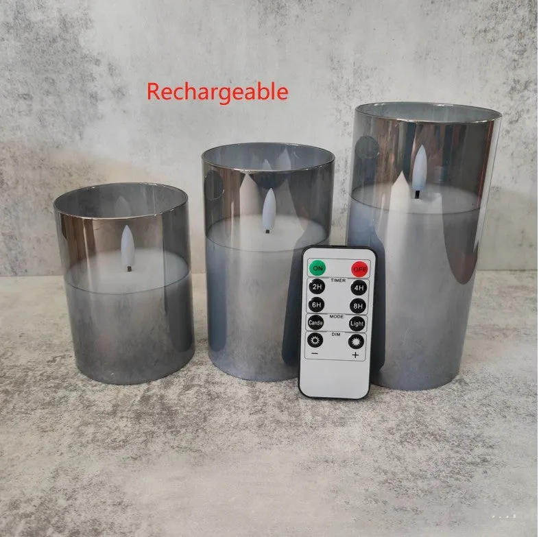 Set of three LED electronic candle lights in gold, gray, and white electroplated glass, sizes 7.5x10cm, 7.5x12.5cm, 7.5x15cm, with a remote control and USB cable.