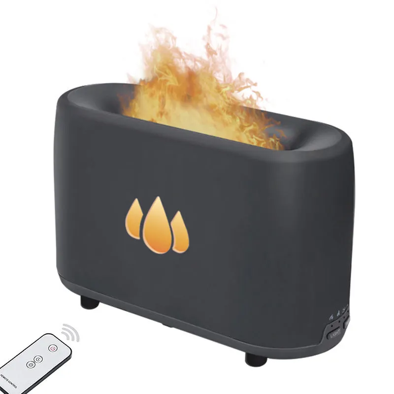 White simulated flame aromatherapy humidifier on desk with mist and soft glow