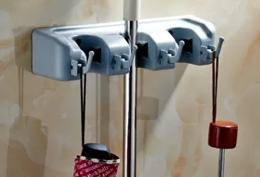 Plastic mop hook wall hanger with 4 hooks for drilling installation, holding a mop and broom