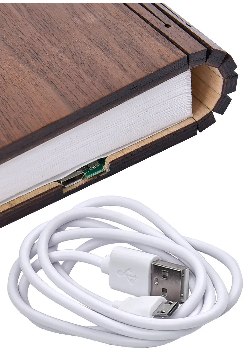 Walnut wooden book light open with colour changing LED pages on a desk