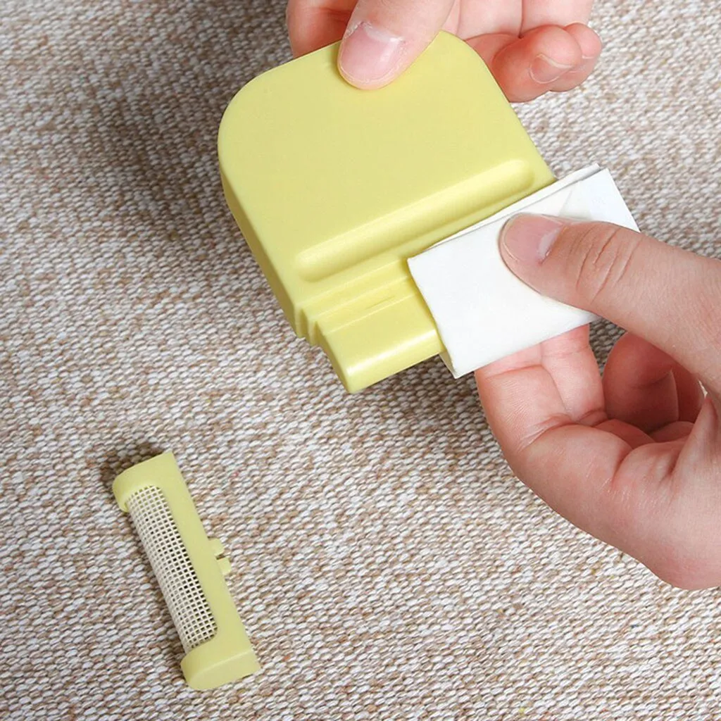 Manual fuzz remover brush with removable catching net for clothes and sofas, compact plastic design