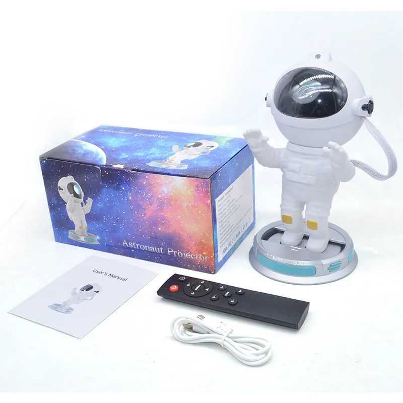 Exit Astronaut Starlight Projection Lamp in white with USB cable and remote control on a table