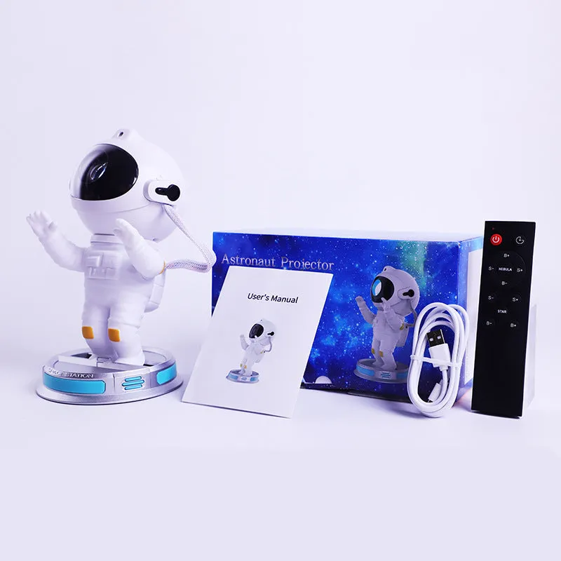 Exit Astronaut Starlight Projection Lamp in white with USB cable and remote control on a table
