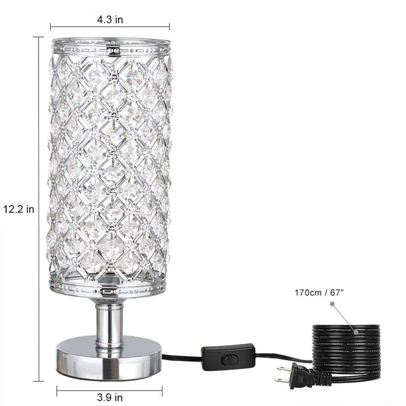 Modern crystal table lamp with hollow-carved design, metal base, gold finish, push button switch, on bedside table