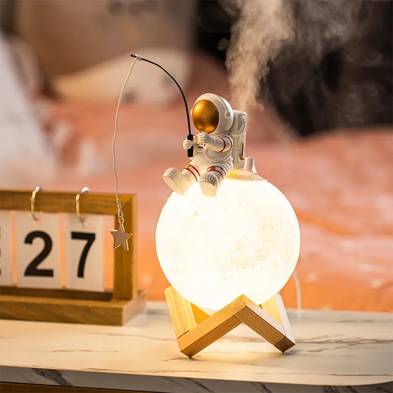 Gold resin astronaut figurine with wooden base, USB cold fog humidifier and night light, 28cm tall