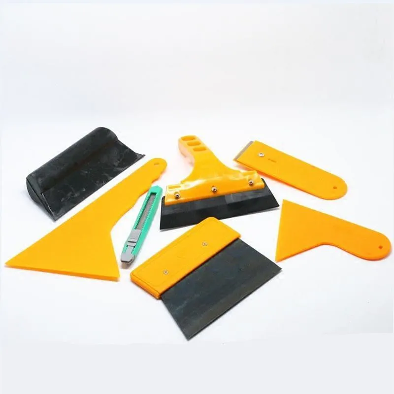 Seven-piece car window tinting tool set with scrapers, knives, and specialised film application tools.