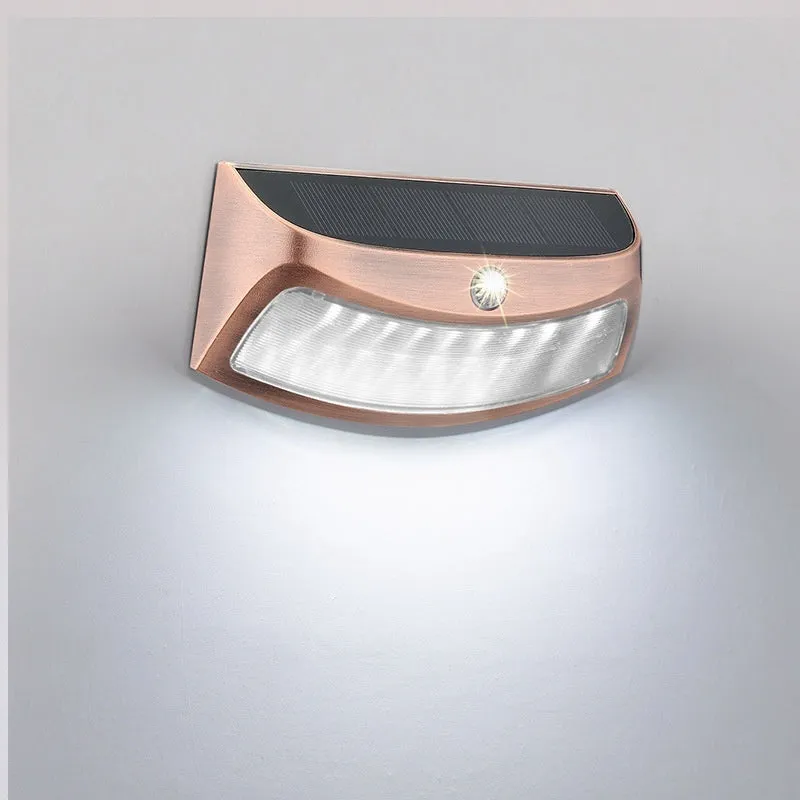 Solar outdoor wall light with smiling face design for garden decoration