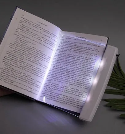 Dimmable LED panel book reading lamp with PMMA acrylic lens on a book page