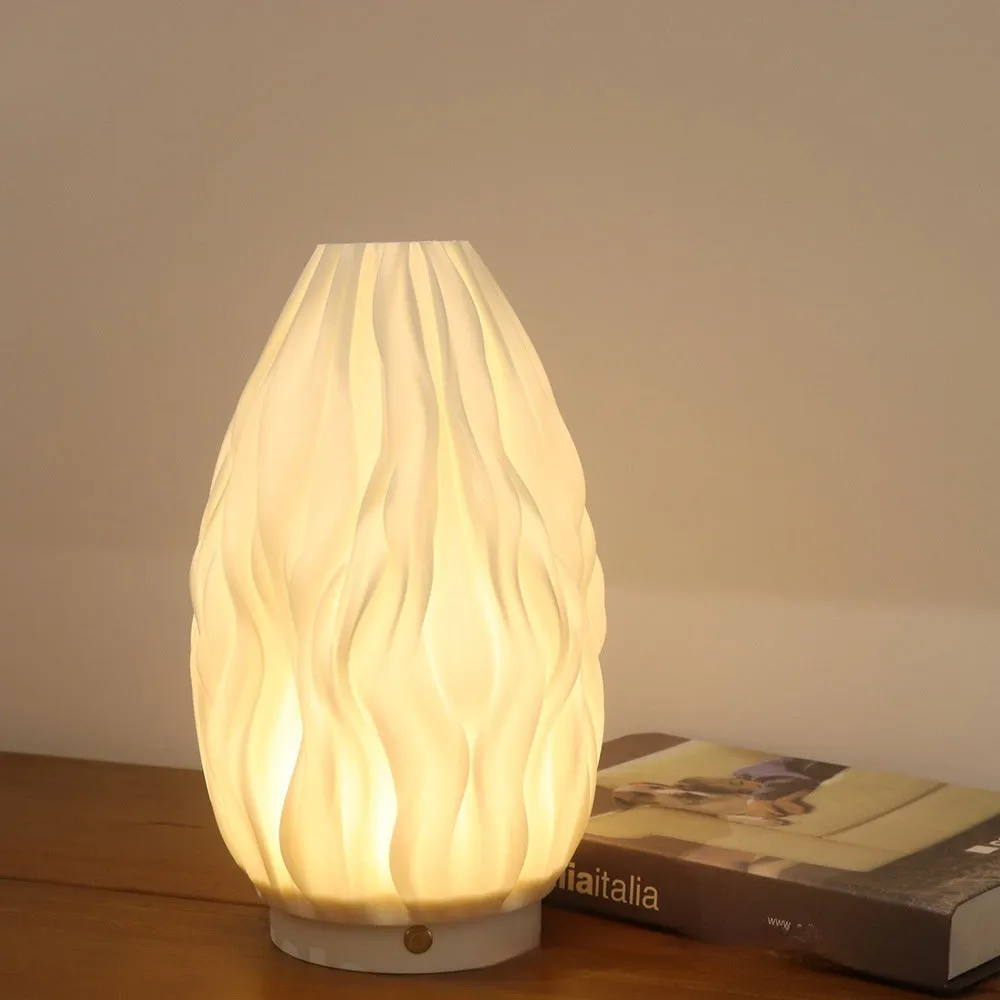 3D printed cylindrical vase night lamp in wood colour finish on a modern bedside table