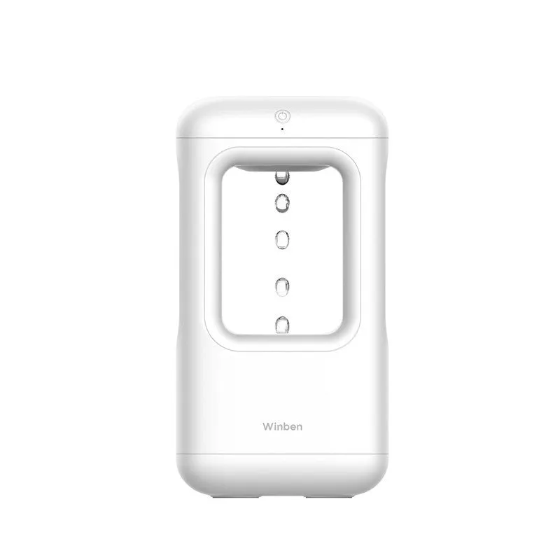 White anti-gravity water drop humidifier with ambient light on bedside table