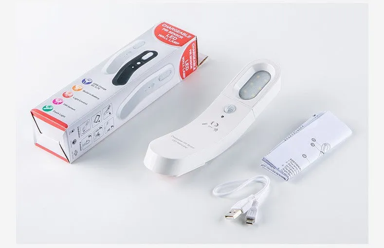USB human body induction night light with light control, black colour, warm style LED lamp on bedside table