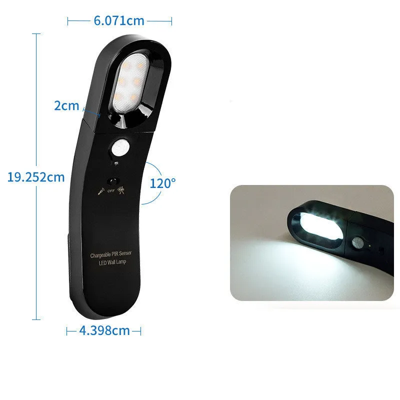 USB human body induction night light with light control, black colour, warm style LED lamp on bedside table