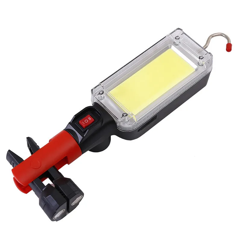 Black portable COB LED flashlight with magnet hook showing USB charging port