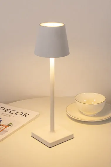 Aluminum LED charging table lamp with touch dimming in black finish on a wooden desk